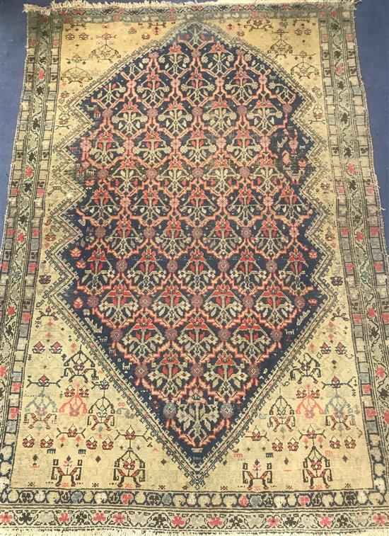 A Caucasian red, blue and cream ground rug 190 x 130cm.